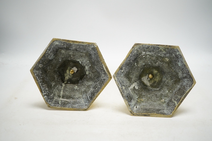 A pair of Dutch style 'Heemskerk' heavy cast brass candlesticks, on hexagonal bases, 24cm. Condition - fair to good